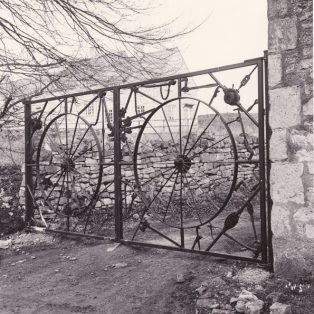 Gates made of old tools and plumbers' implements